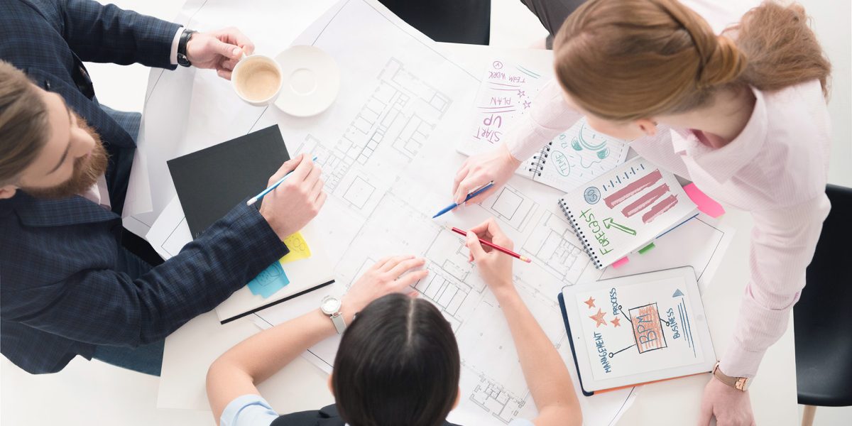 top-view-of-young-business-people-working-on-proje-2024-11-18-17-40-04-utc